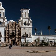 2018-03-23_32196_WTA_5DM4 - Panorama - 6 Images - 16228x6455_0000-2 Mission San Xavier del Bac is a historic Spanish Catholic mission located about 10 miles (16 km) south of downtown Tucson, Arizona, on the Tohono O'odham San...