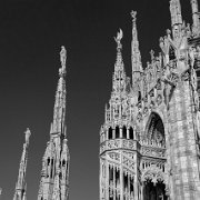 IMG_7117_bw_t-2 Milan Cathedral (Italian: Duomo di Milano) is the cathedral church of Milan, Italy. Dedicated to Santa Maria Nascente (Saint Mary Nascent), it is the seat of...