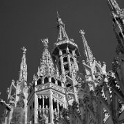 IMG_7141_bw_t-2 Milan Cathedral (Italian: Duomo di Milano) is the cathedral church of Milan, Italy. Dedicated to Santa Maria Nascente (Saint Mary Nascent), it is the seat of...