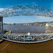 2023-04-14_167560_WTA_Mavic3_Pano_Original Size 12100x7261_9 Images The Aerial Lift Bridge is an iconic landmark located in Duluth, Minnesota. The bridge was first constructed in 1905 as a transporter bridge to move people and...