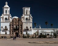 2018-03-23_32196_WTA_5DM4 - Panorama - 6 Images - 16228x6455_0000-2 Mission San Xavier del Bac is a historic Spanish Catholic mission located about 10 miles (16 km) south of downtown Tucson, Arizona, on the Tohono O'odham San...