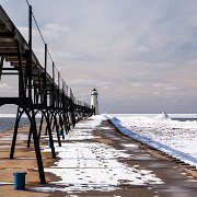2009-02-16_00695_WTA_5DM2 The Manistee Pierhead lights are a pair of active aids to navigation located on the north and south pier in the harbor of Manistee, Michigan, 